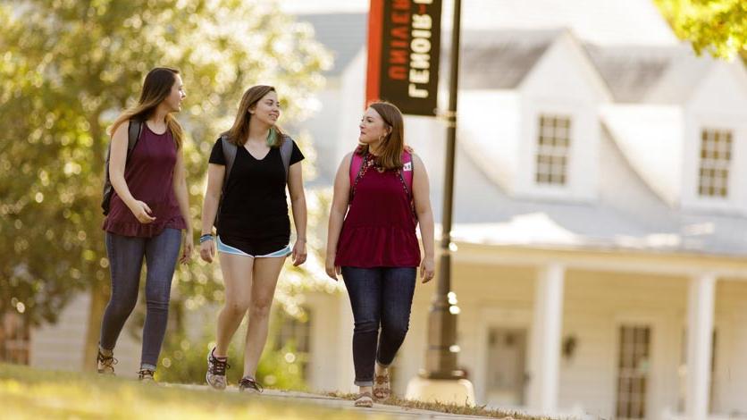 Students walking on sidewalk to class